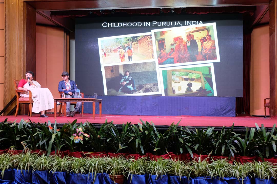 Pinki being interviewed on stage at recon about her experience as a woman in sports